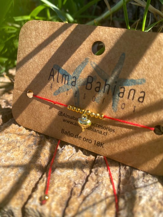Pulsera roja corazón inflado dorado